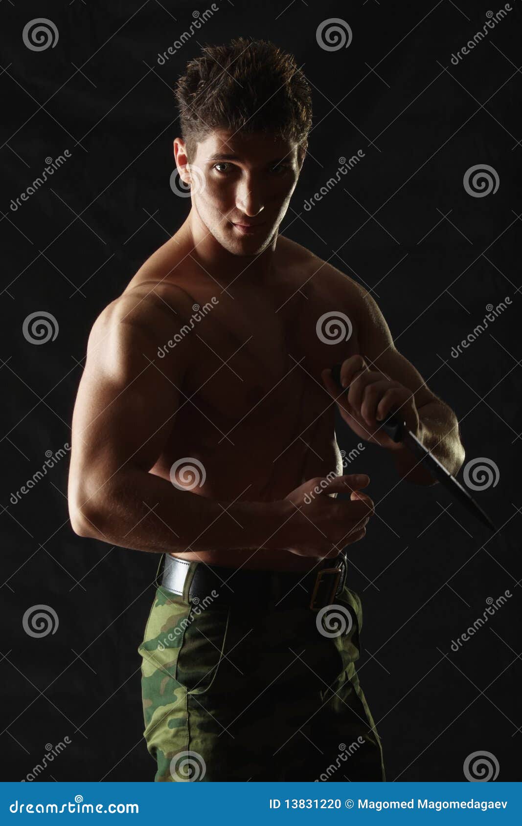 Serious guy with knife stock photo. Image of defense 13831220