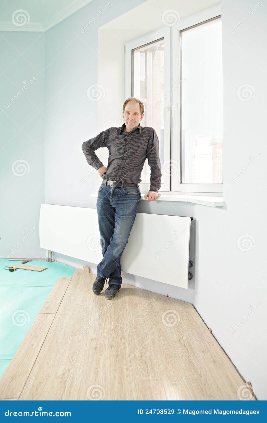 Serious Guy on New Flooring Stock Image Image of laminate, window