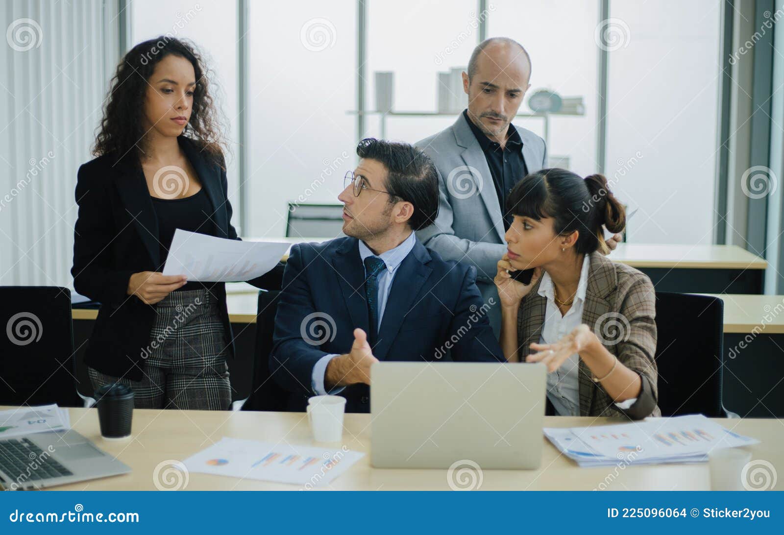 serious international diverse business team people discuss financial result review with laptop
