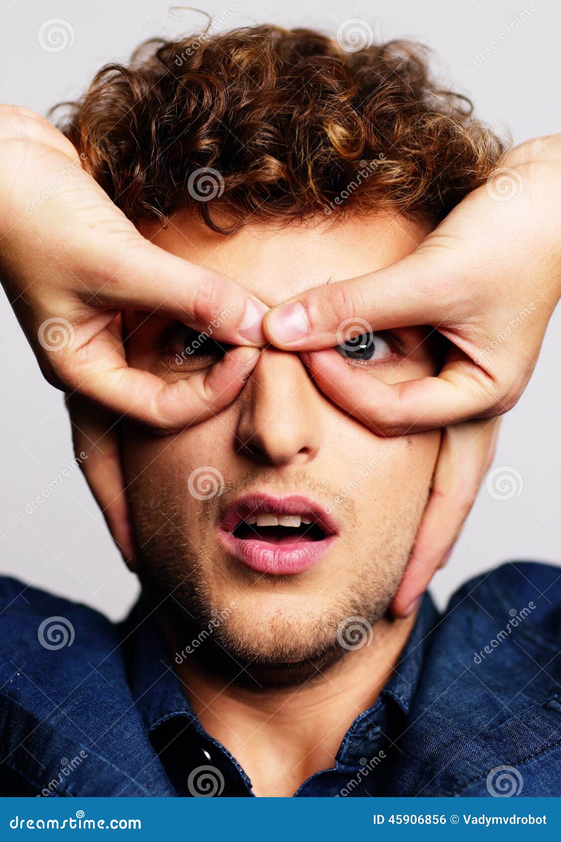 Serious Man with Hand Over Eyes, Stock Photo Image of clothing