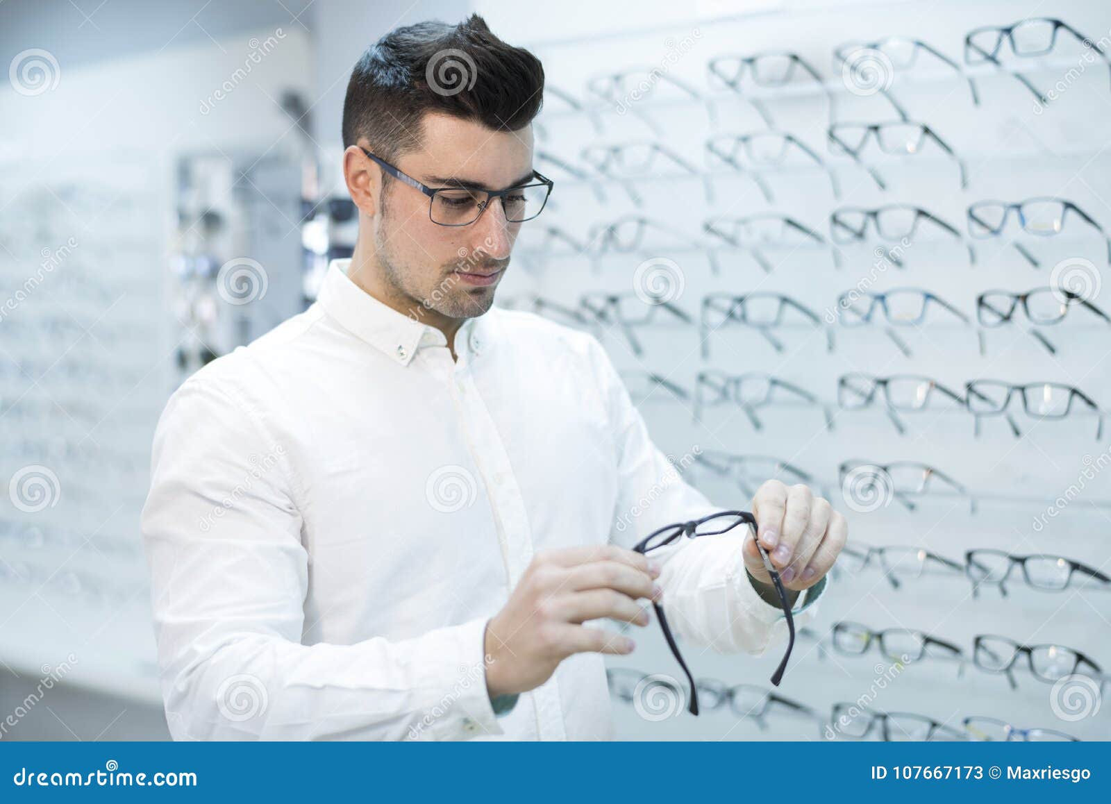 Serious Man Looking Glasses Frame in Store Stock Image - Image of ...