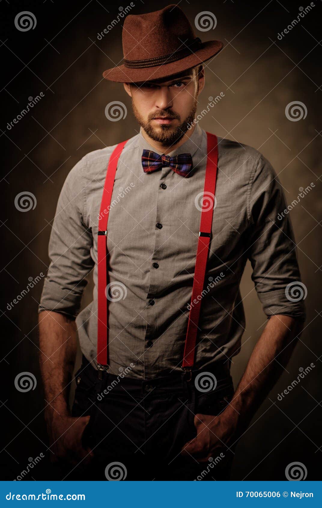 Serious Old-fashioned Man with Hat Wearing Suspenders and Bow Tie ...