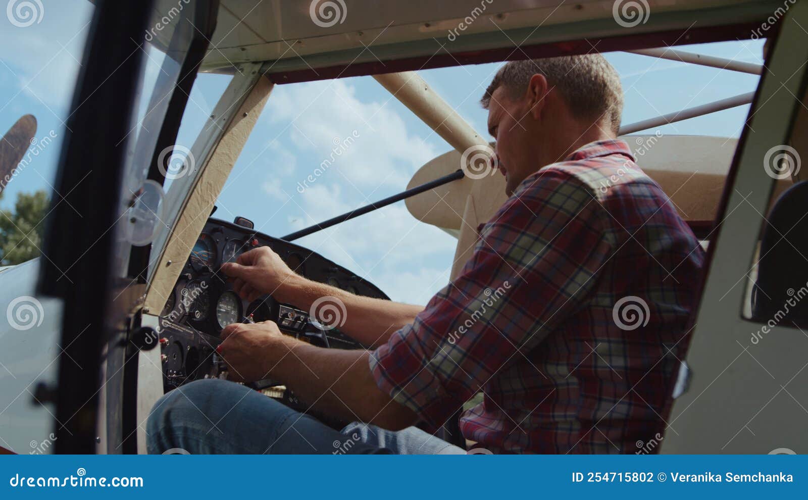Airplane Pilot Checking Control Panel Steering Wheel before Flight