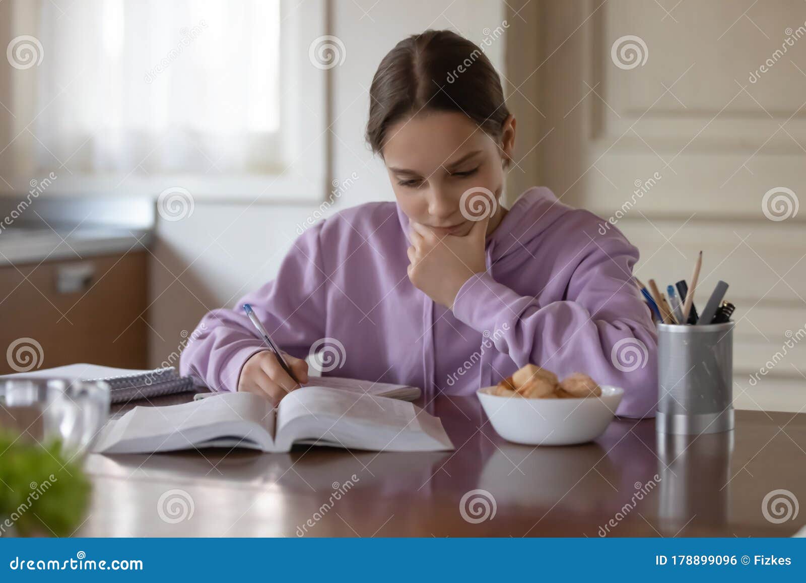 Child doing her homework stock photo. Image of thirsty 