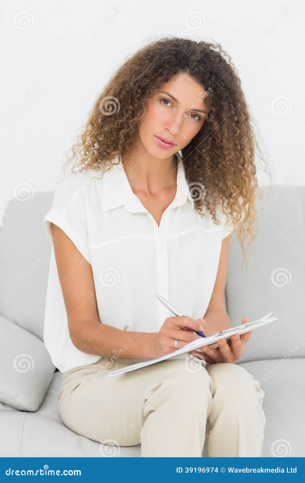 Serious Therapist Looking at Camera Taking Notes Stock Photo Image of