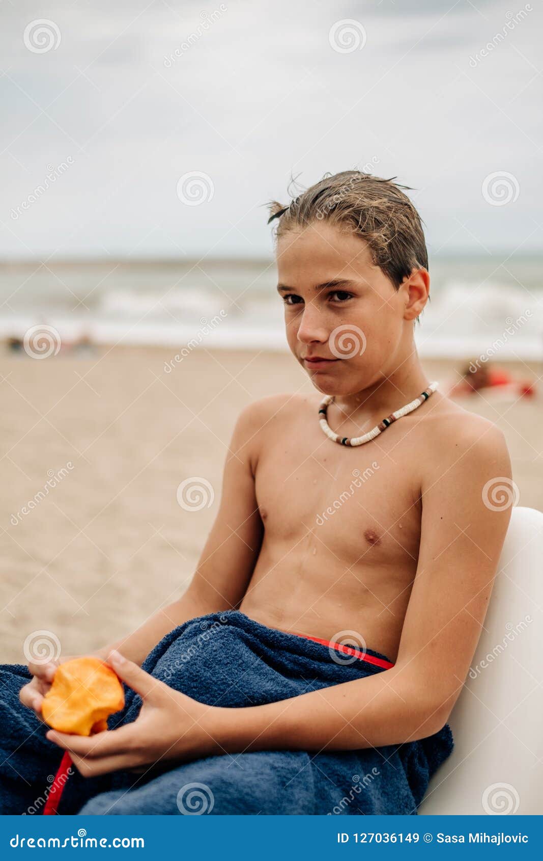 Serious Wet Boy Holding Apricot on the Beach Stock Image Image of