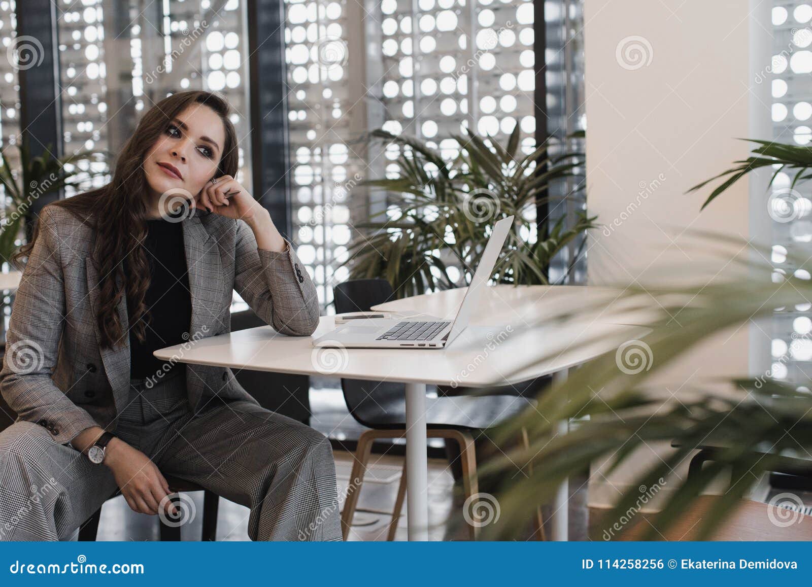 Serious Woman In A Public Place Looks At Camera Stock