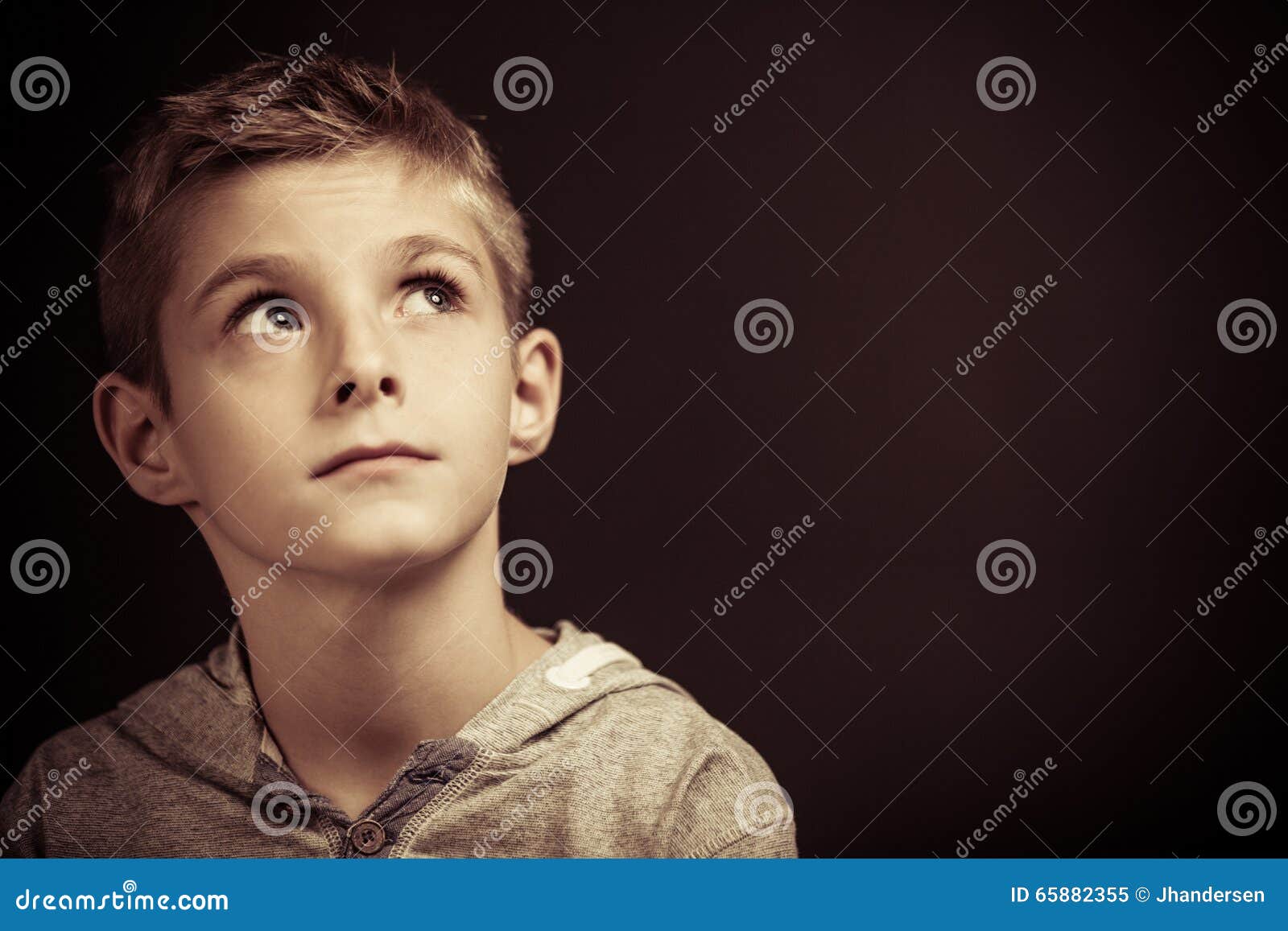 Serious Young Boy Sitting Thinking Stock Image - Image of youth, thinks ...