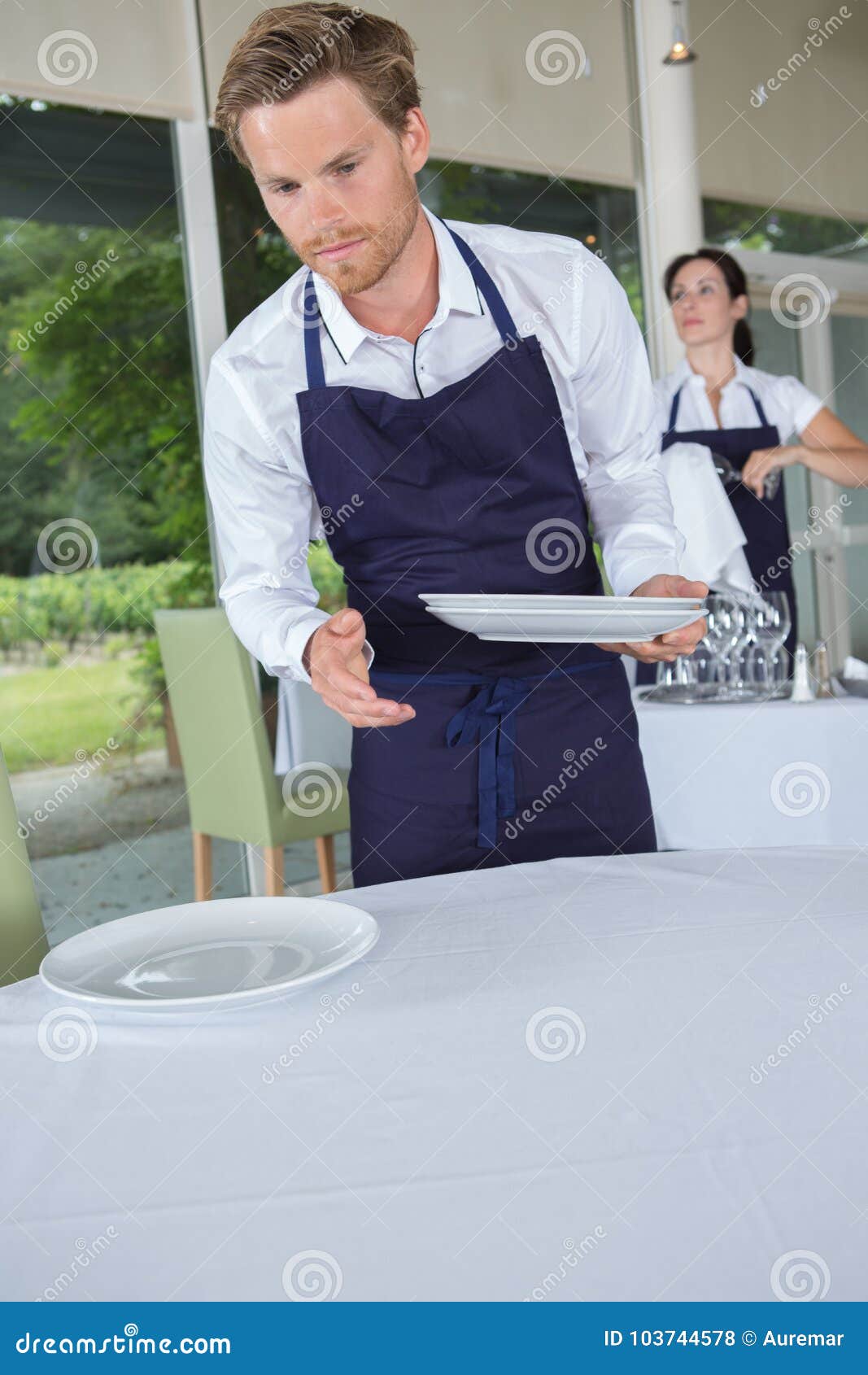 Server in Restaurant Holding Plates Stock Photo Image of service