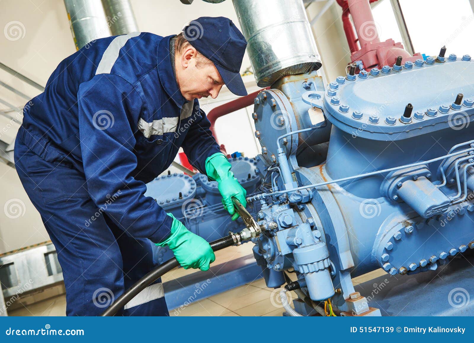 service worker at industrial compressor station