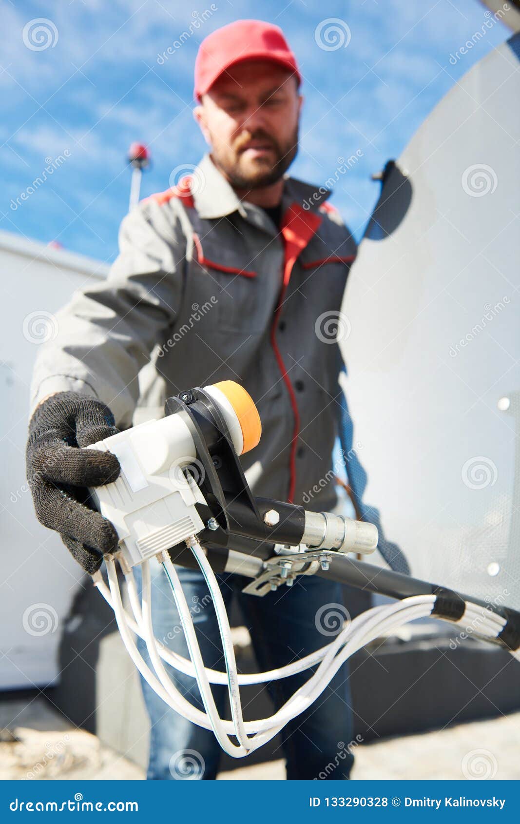 Service Worker Installing and Fitting Satellite Antenna Dish for Cable