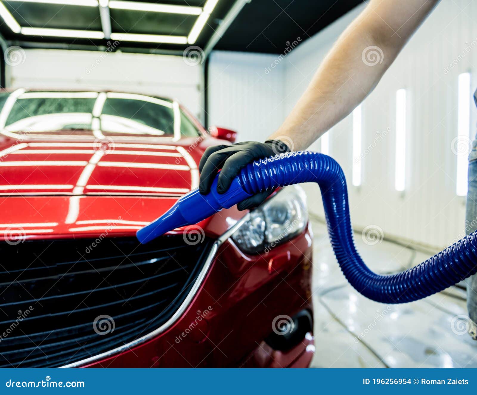 Service Worker Makes Automatic Drying of the Car after Washing. Stock