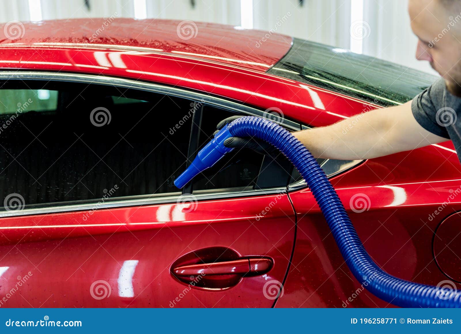 Service Worker Makes Automatic Drying of the Car after Washing. Stock