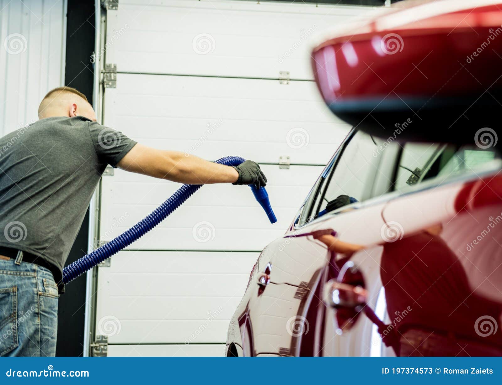 Service Worker Makes Automatic Drying of the Car after Washing. Stock