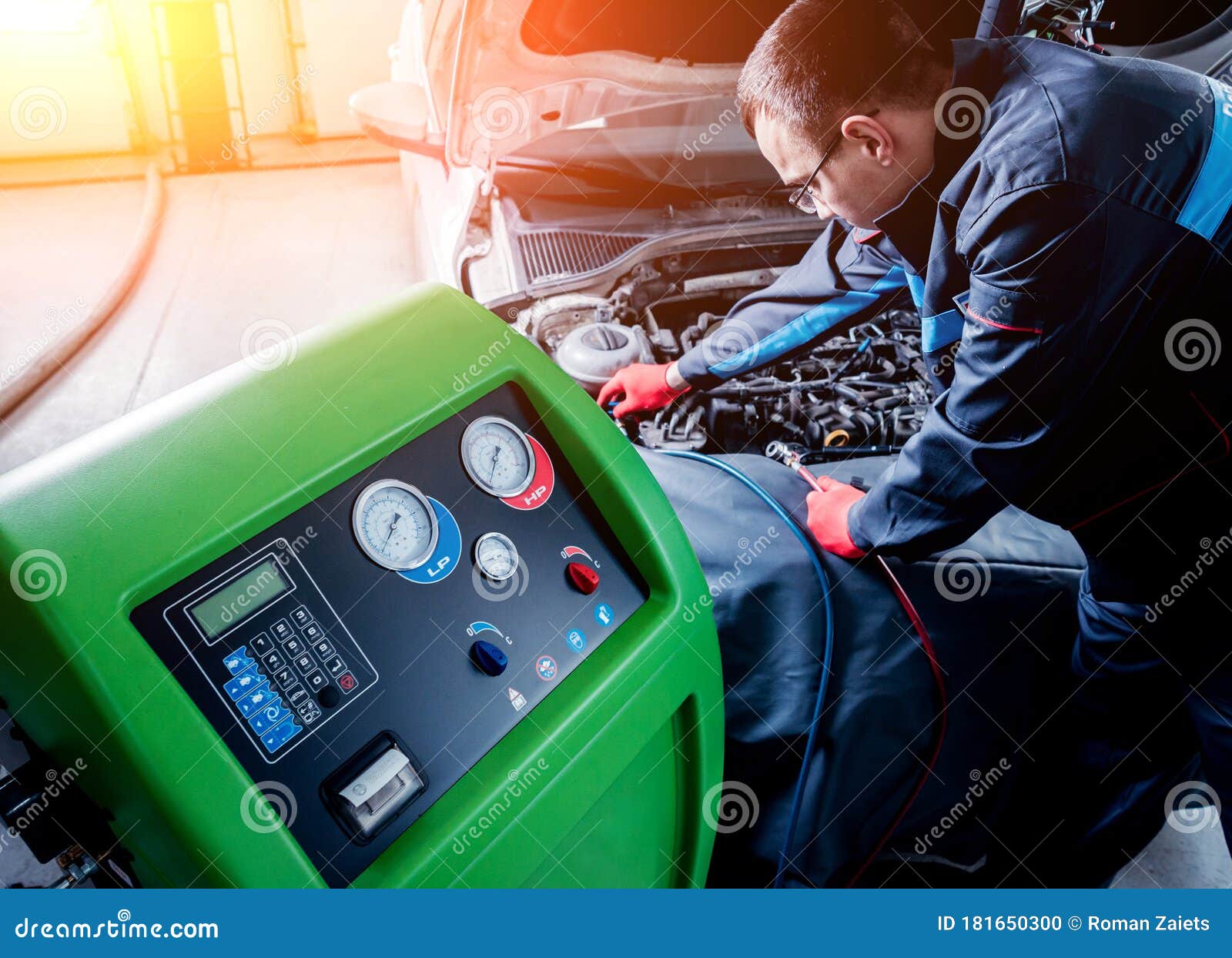 Servicing Car Air Conditioner. Auto Service Station. Stock Photo