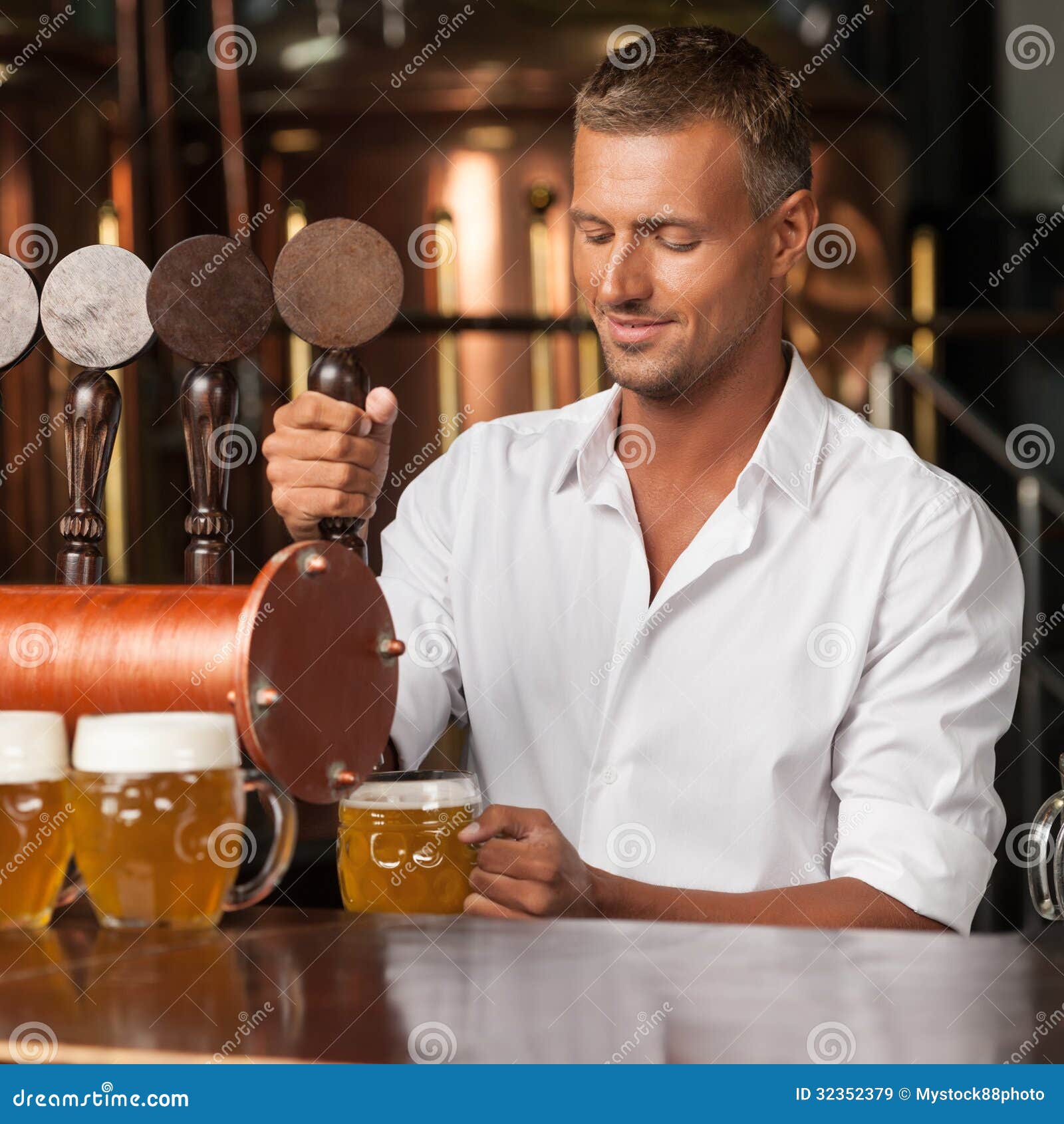 Serving The Best Beer In Town. Handsome Bartender In White Shirt