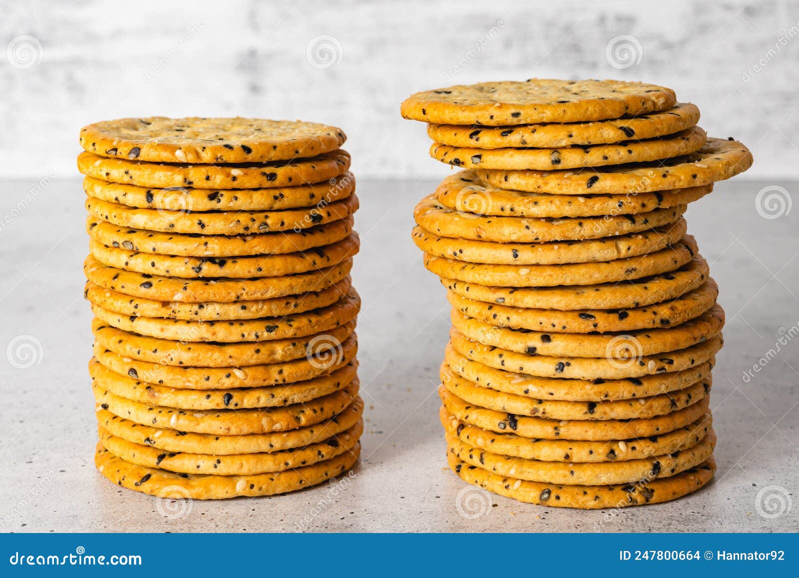 Sesame and Poppy Seed Crackers Close Up on Grey Background Stock Photo