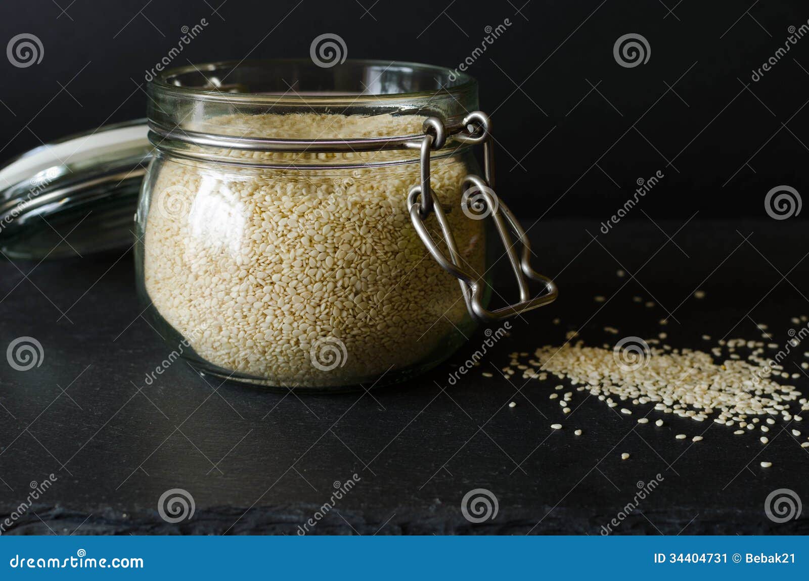 Sesame Seeds in a Jar, on a Black Background Stock Image Image of
