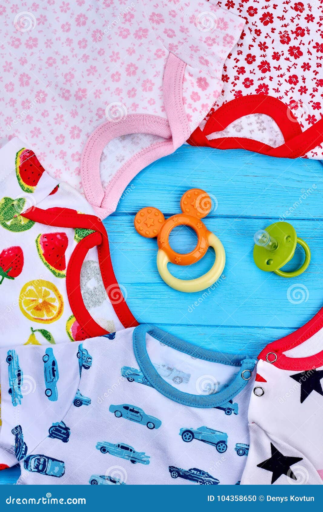 Set of Baby Clothes and Toys in the Middle. Stock Photo - Image of ...