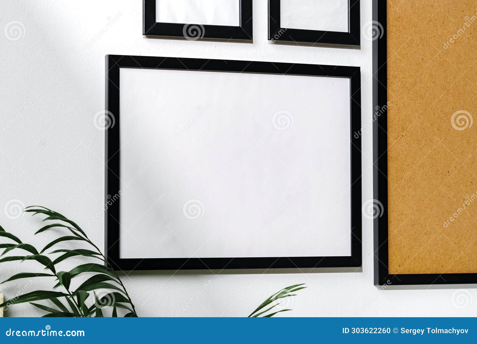 Set of Black Frames on White Wall with Copy Space Stock Photo Image