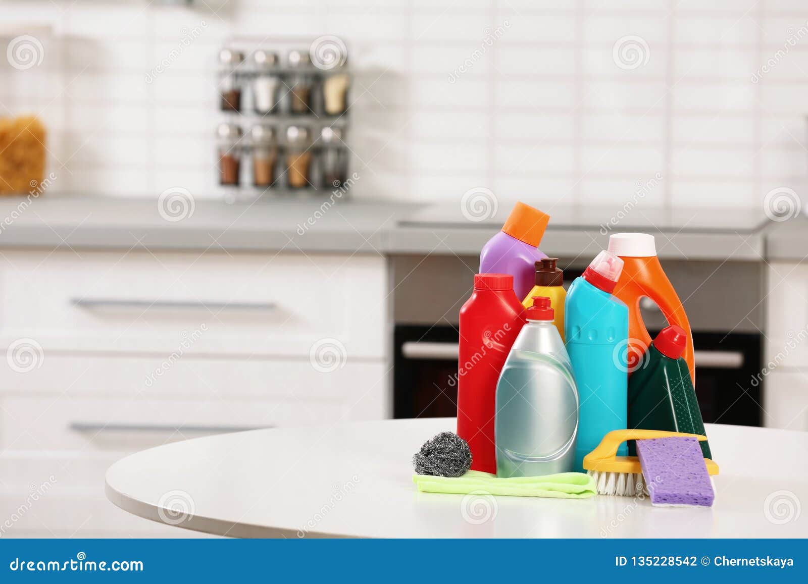 Set of Cleaning Supplies on Table in Kitchen. Stock Photo Image of