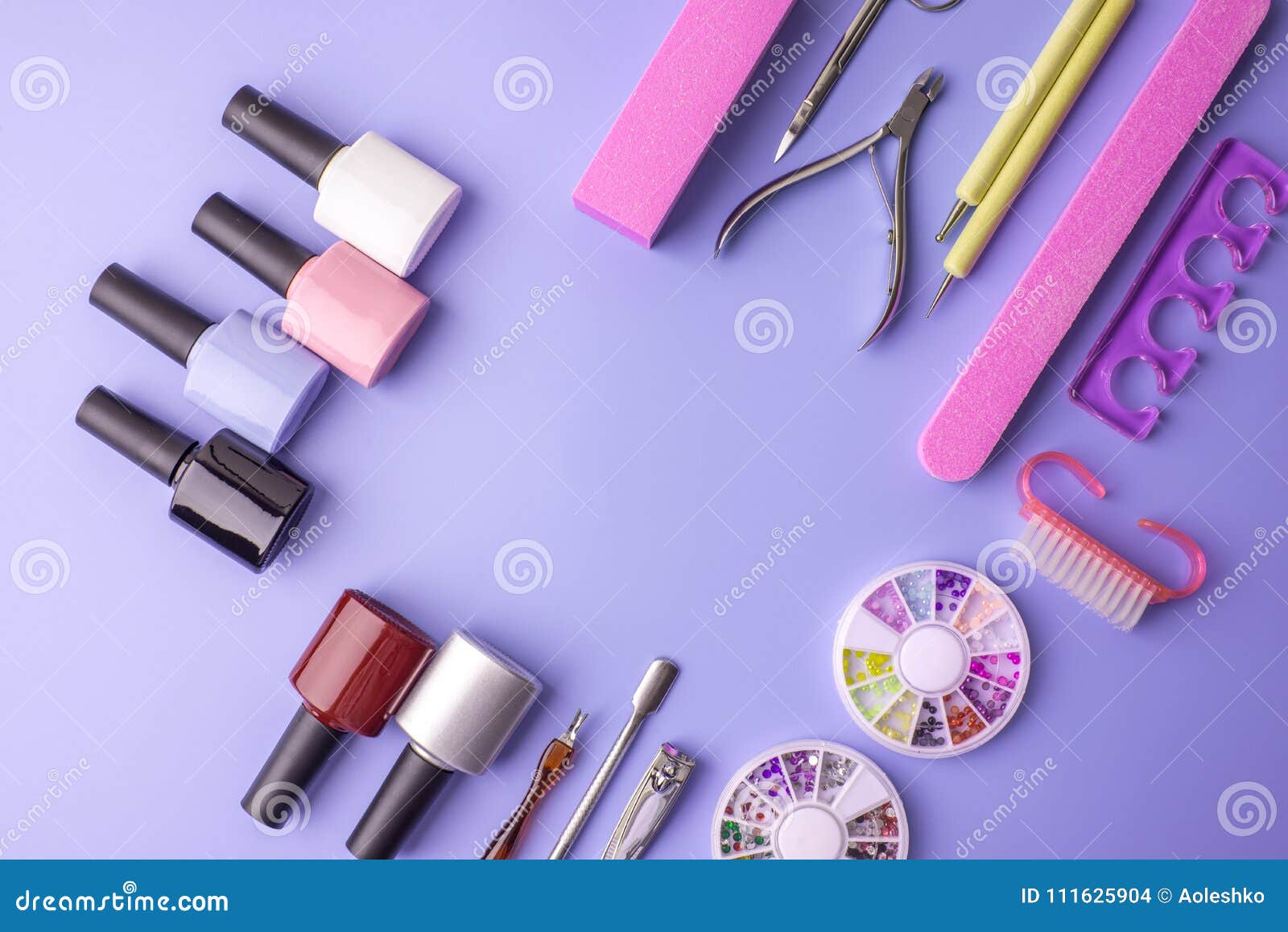 Set of Cosmetic Tools for Manicure and Pedicure on a Purple Background ...