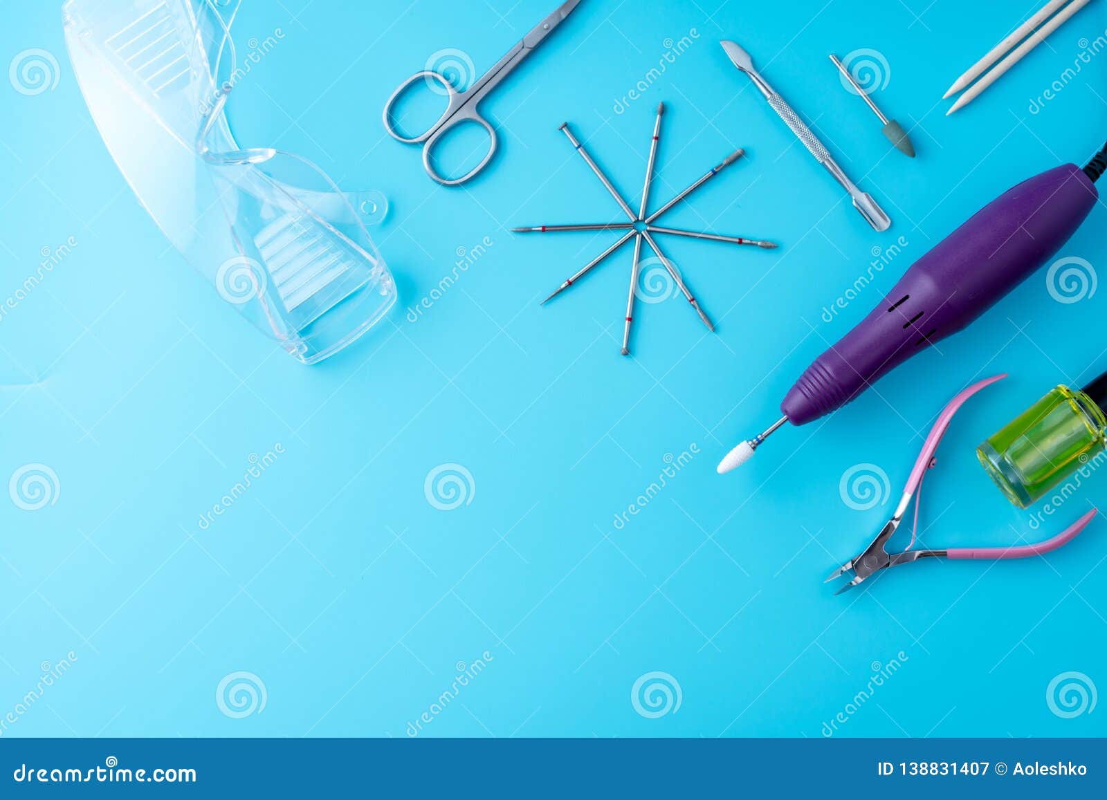 Set of Cosmetic Tools for Professional Manicure and Nail Care on a Blue