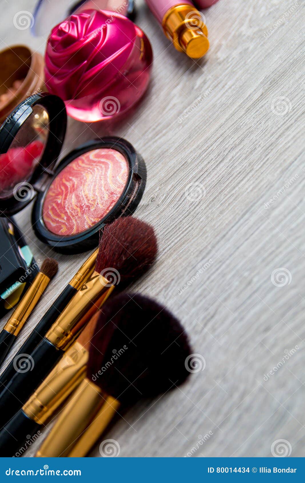 Set Of Decorative Cosmetics And Brushes On Grey Wooden Background