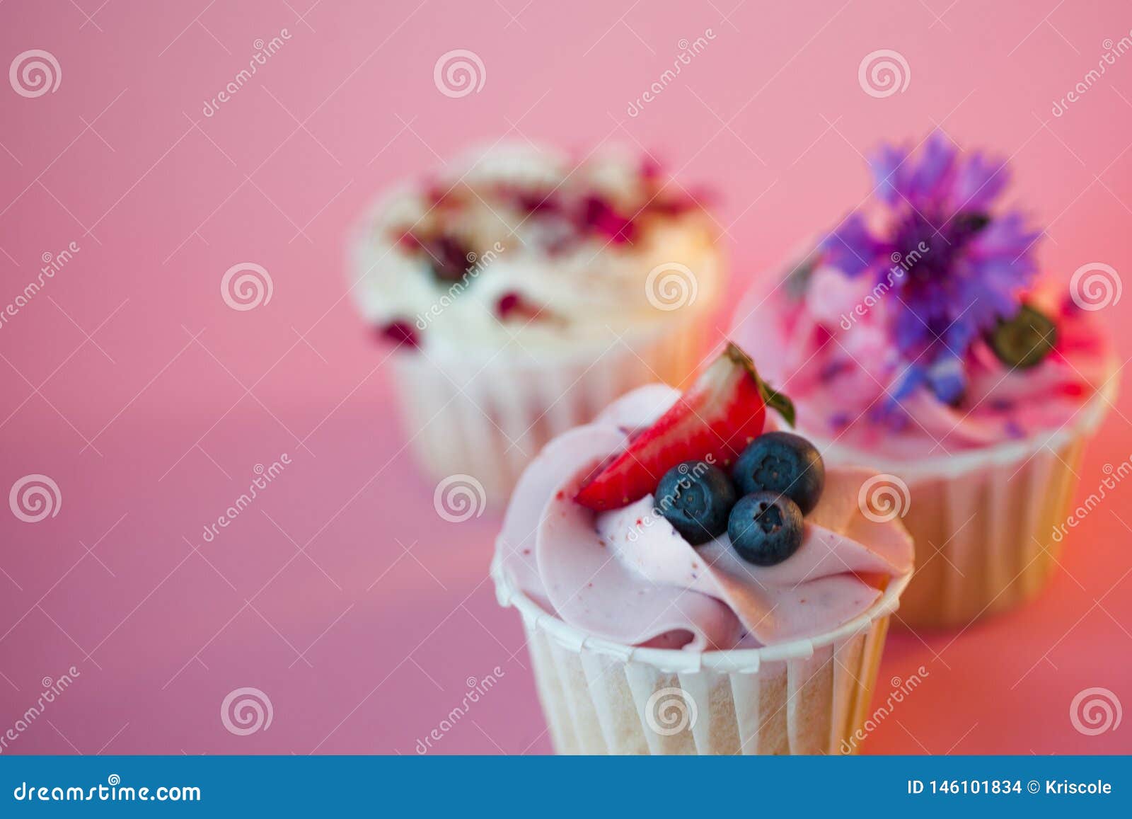 set of delicious cupcakes with different fillings and cream. three muffin`s with cream