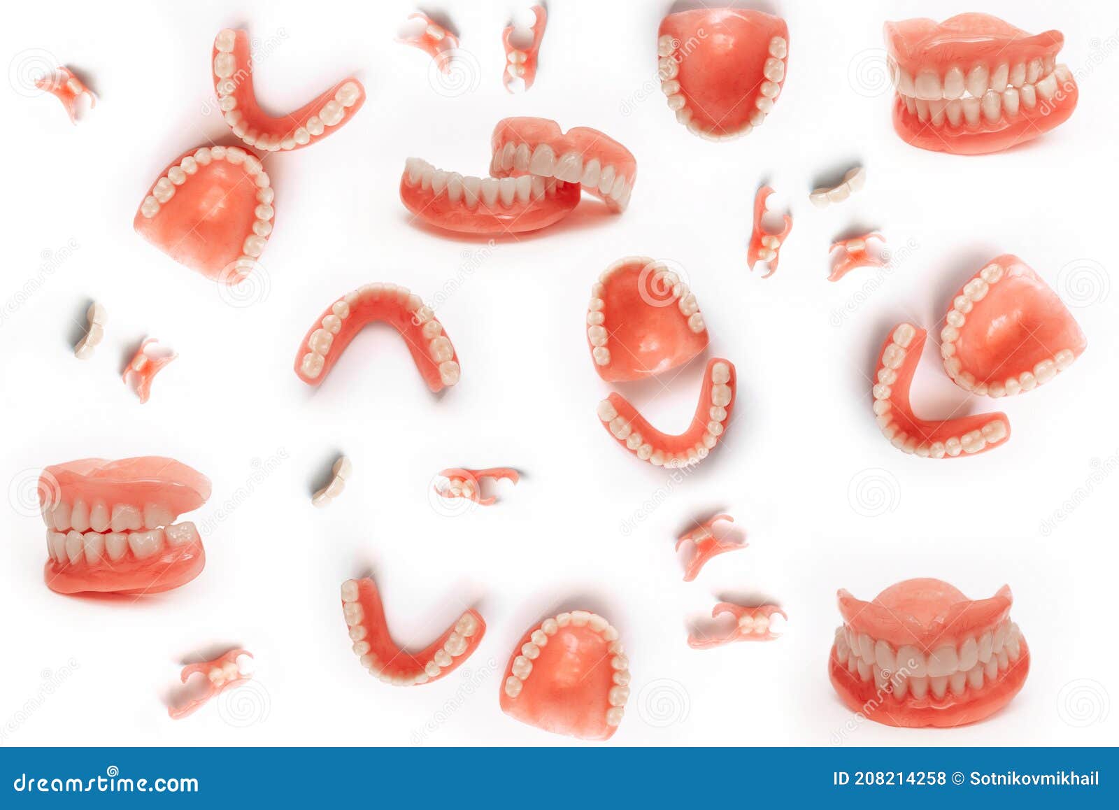 Set of Dentures on a White Background. Full Removable Plastic Denture