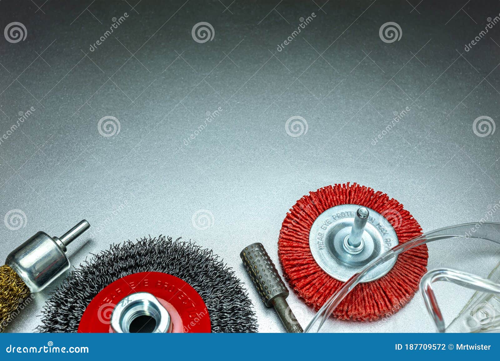 Set of Different Abrasive Tools and Protective Safety Glasses on Grey