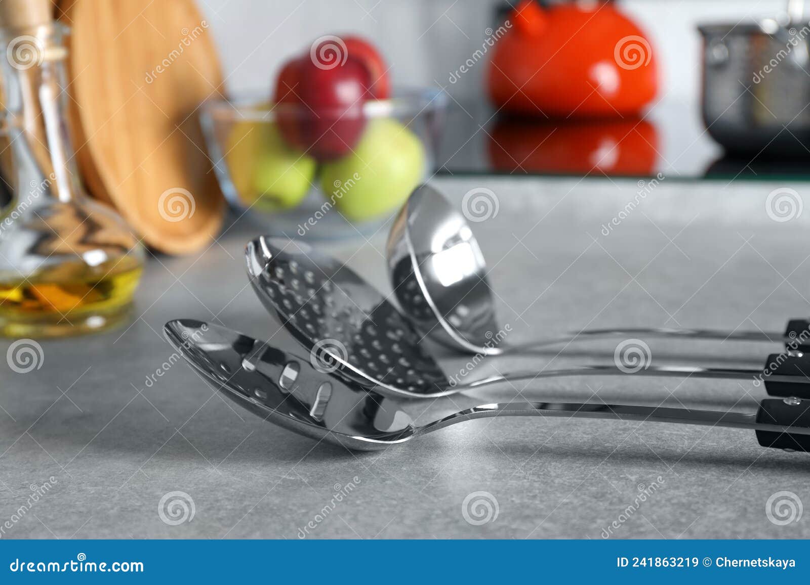 Set of Different Cooking Utensils on Grey Countertop in Kitchen