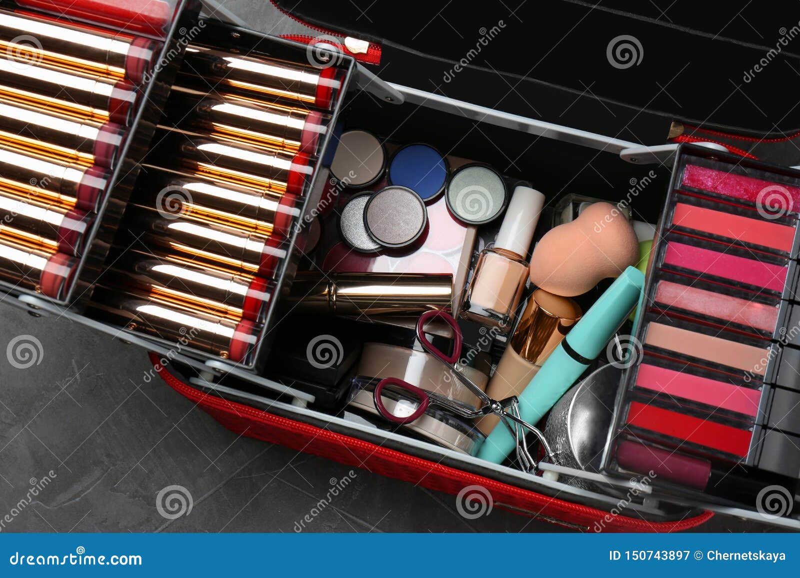 Set of Different Professional Makeup Products in Case on Table Stock