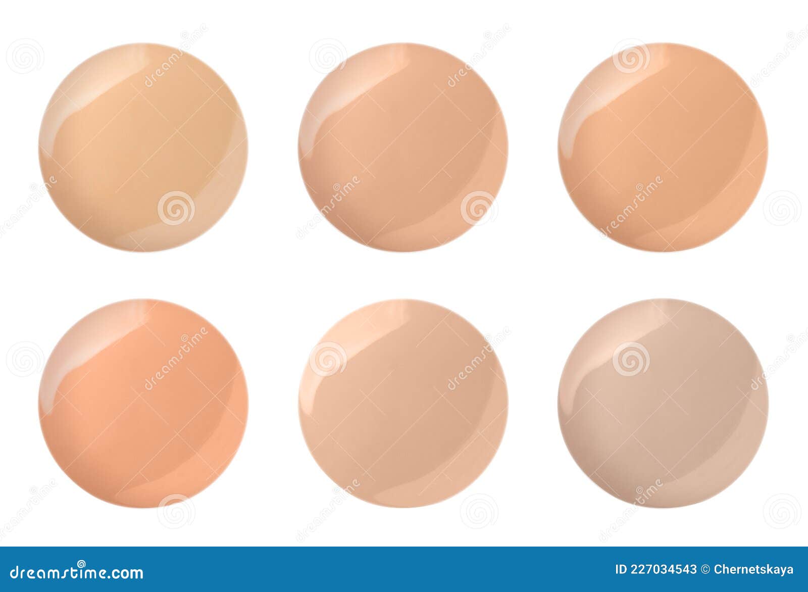 Set with Different Shades of Liquid Skin Foundation on White Background