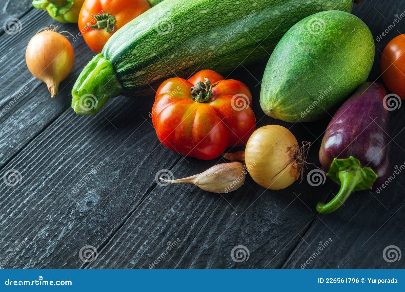 a set of fresh vegetables for a salad diet on a vintage table. cooking salad in the restaurant kitchen. free ad space