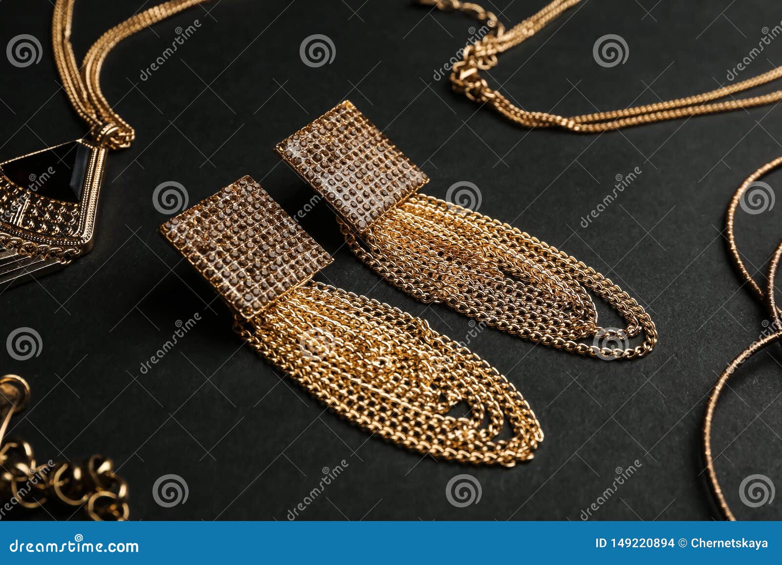 Set Of Gold Jewelry On Black Background Stock Photo Image of