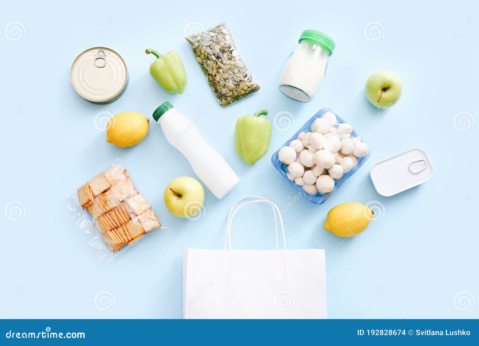 set of grocery items from canned food, vegetables, cereal on blue background. food delivery concept. donation concept