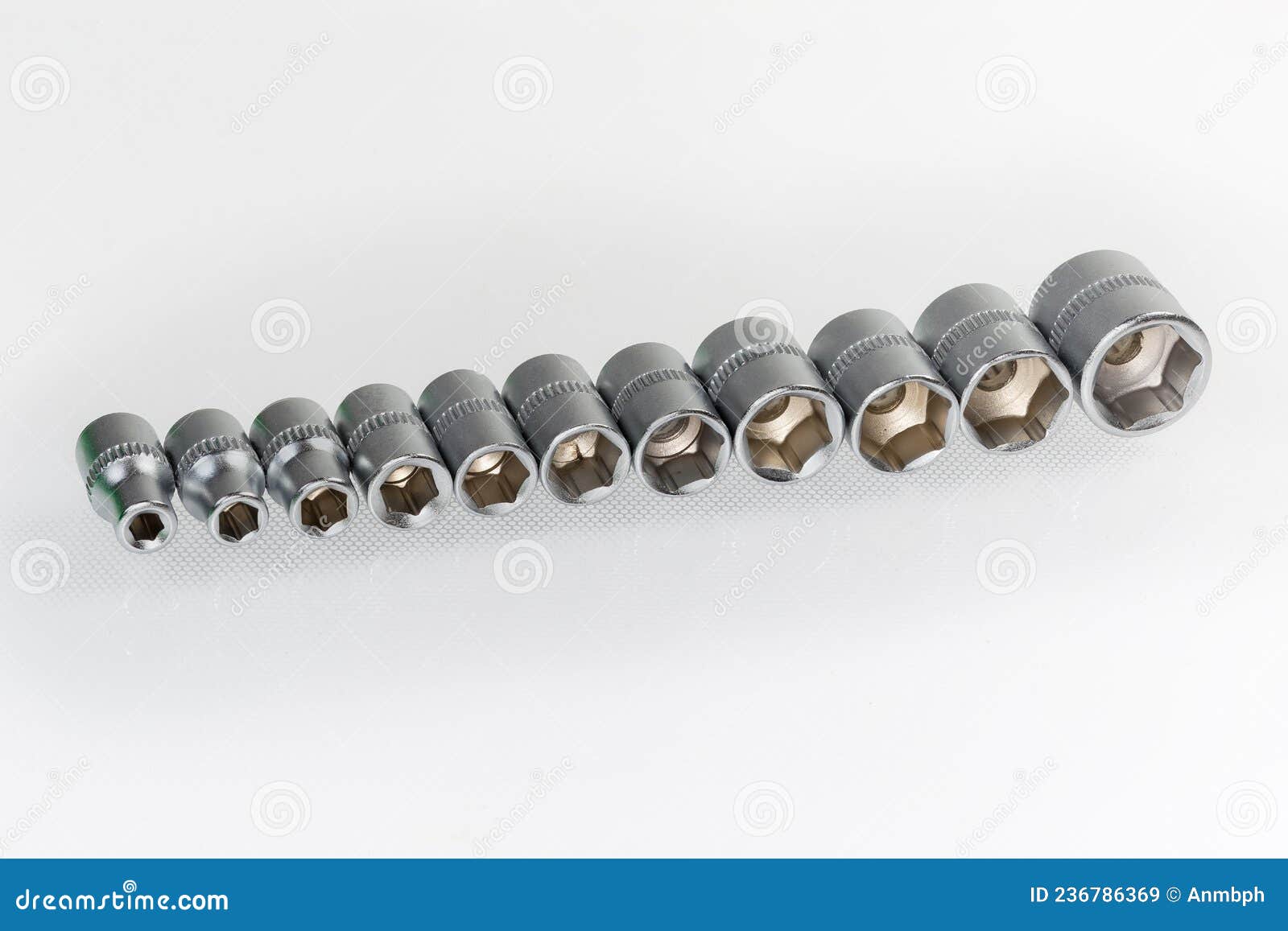 Set of the Hexagonal Sockets Different Sizes on Light Surface Stock