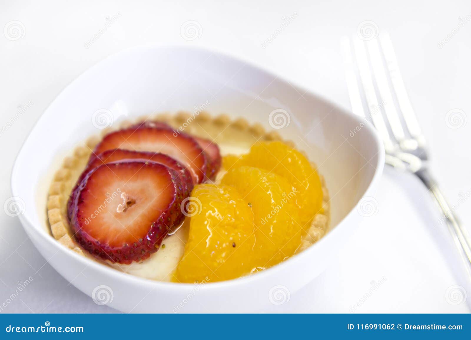 set inflight meal fruit on a tray, on a white table