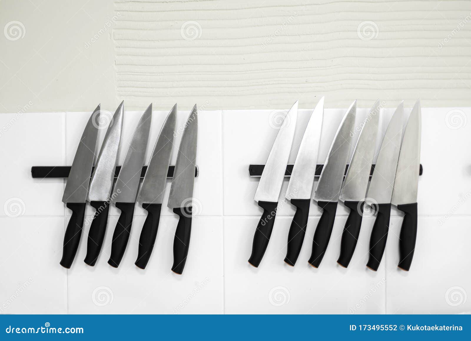 Set of Kitchen Knives on Tapes in the Kitchen Stock Photo