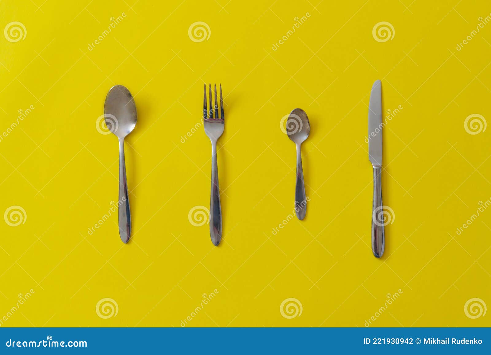 A Set of Kitchenware Utensil Cutlery, Knife, Spoon and Fork Isolated on