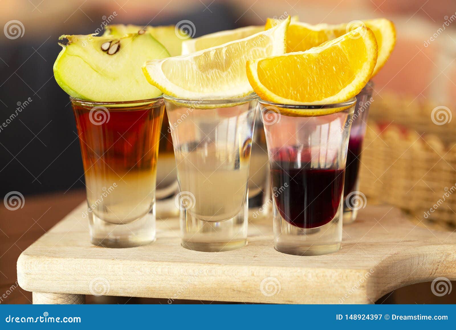 A Set of Layered Cocktails in Glasses Shooters with Fruit As a Snack ...