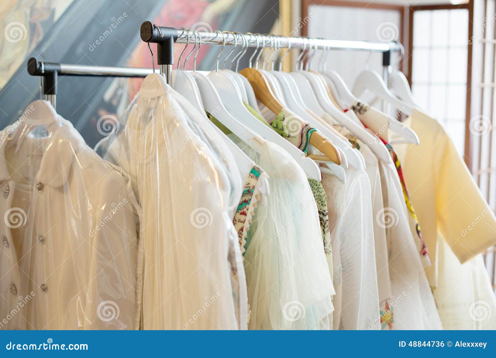 Set of Light Colored Dresses on a Wooden Hangers Stock Photo Image of