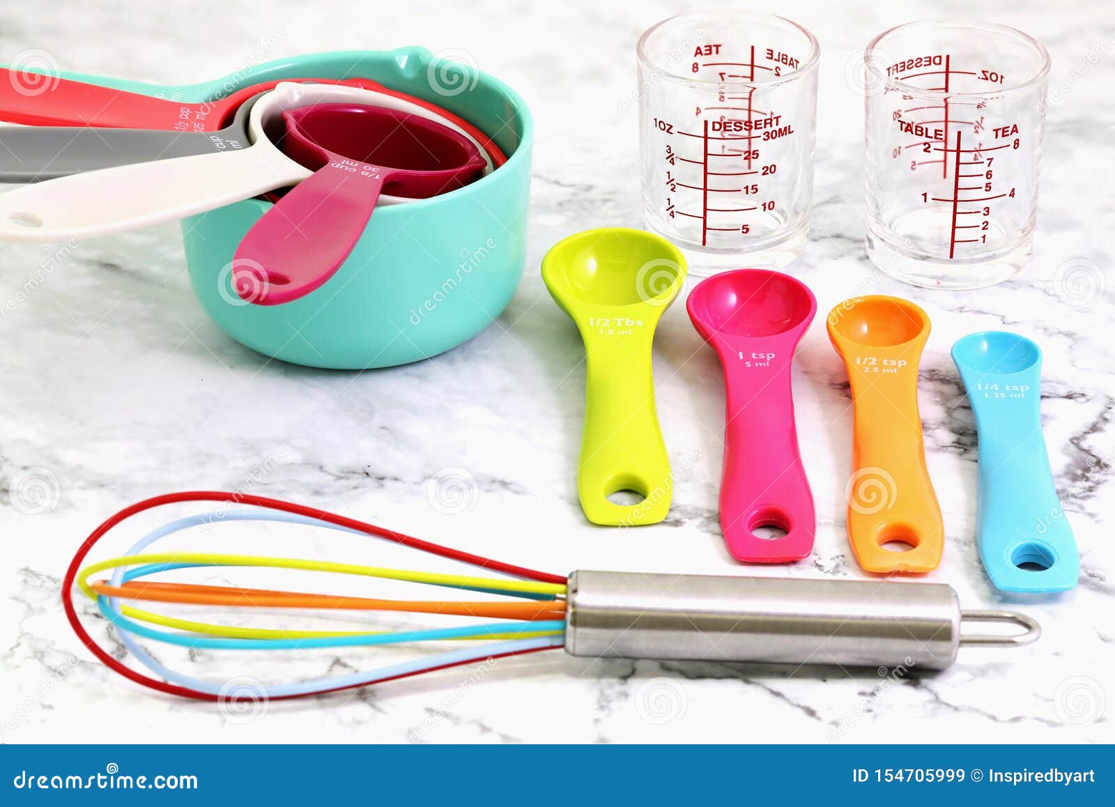 Set of Measuring Cups, Measuring Spoons, Measuring Glasses and Silicone  Whisk Use in Cooking Lay on Marble Tabletop Stock Image - Image of  equipment, instrument: 154705999