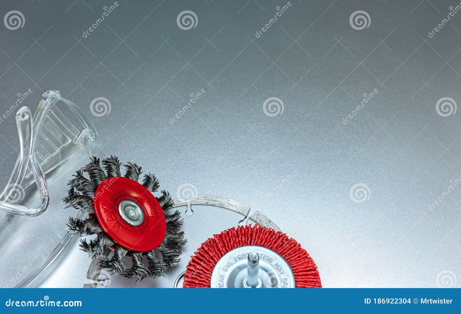 Set of Modern Abrasive Tools and Protective Safety Glasses on Grey