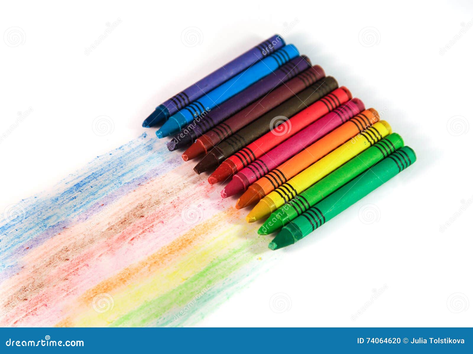 Set of Multicolored Wax Crayons with Drawing Stripes on a White Stock