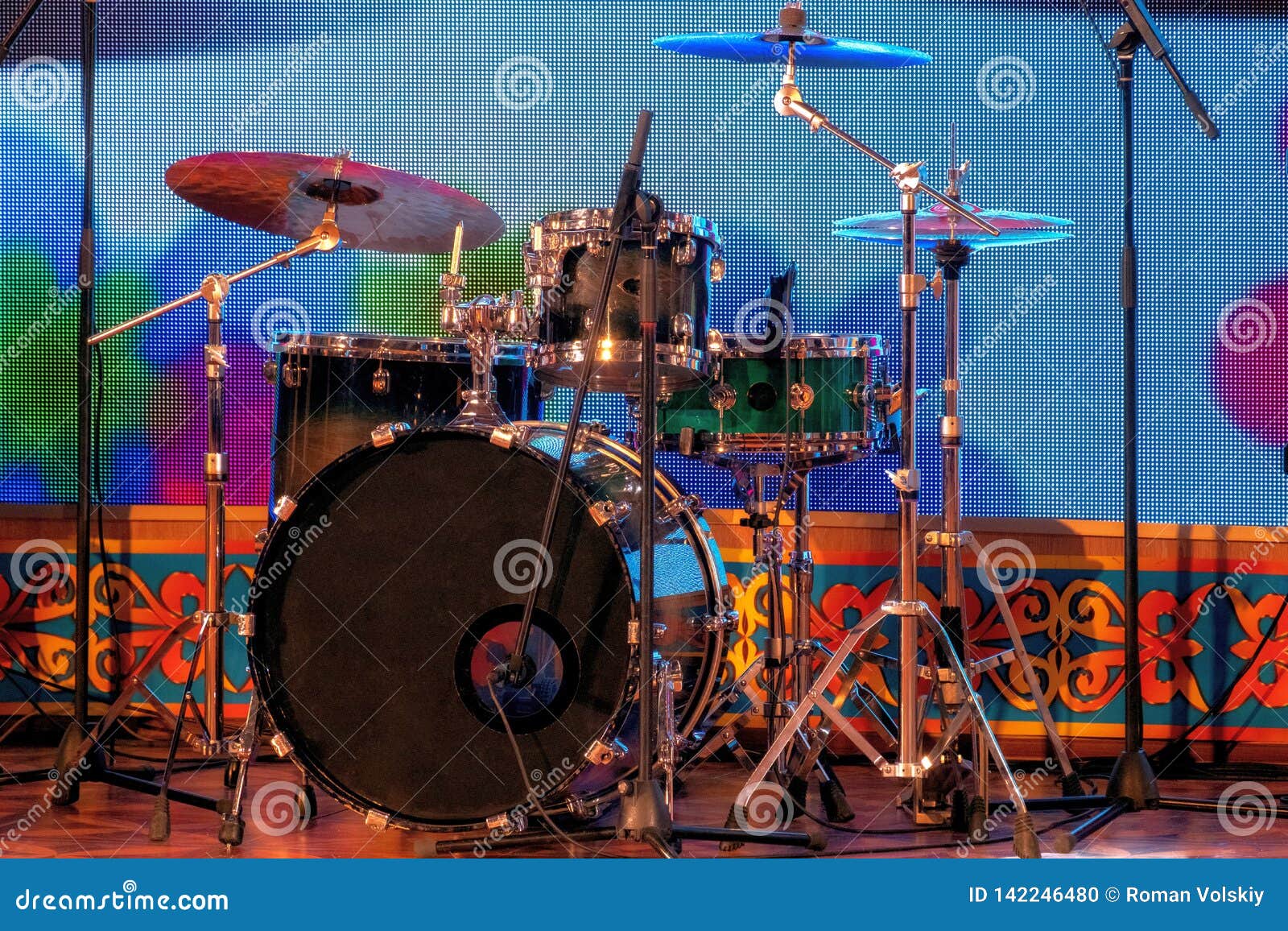 A Set of Percussion Instruments on Stage. Drums and Plates. Racks and