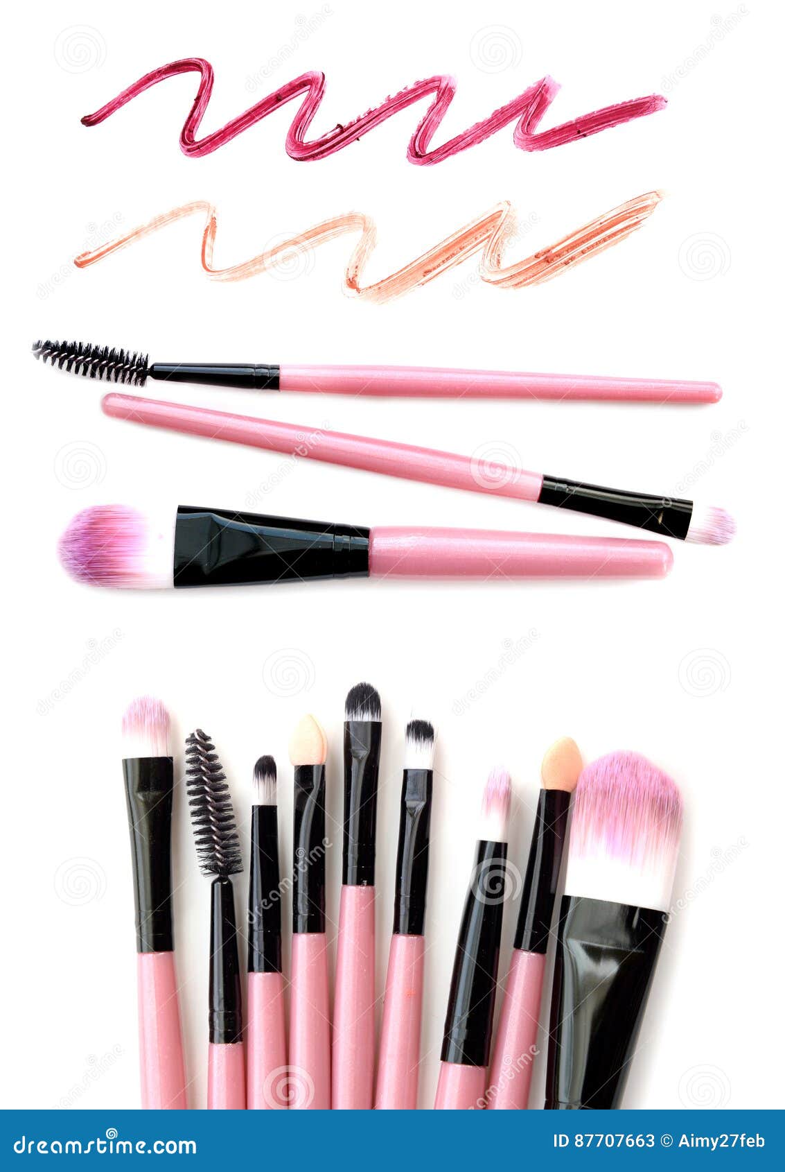 Set of Pink Makeup Brushes with Lipstick Trace Isolated on White