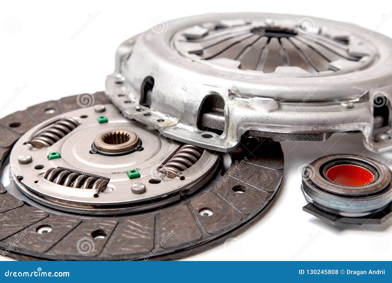 set of replacement automotive clutch  on white background. disc and clutch basket with release bearing.