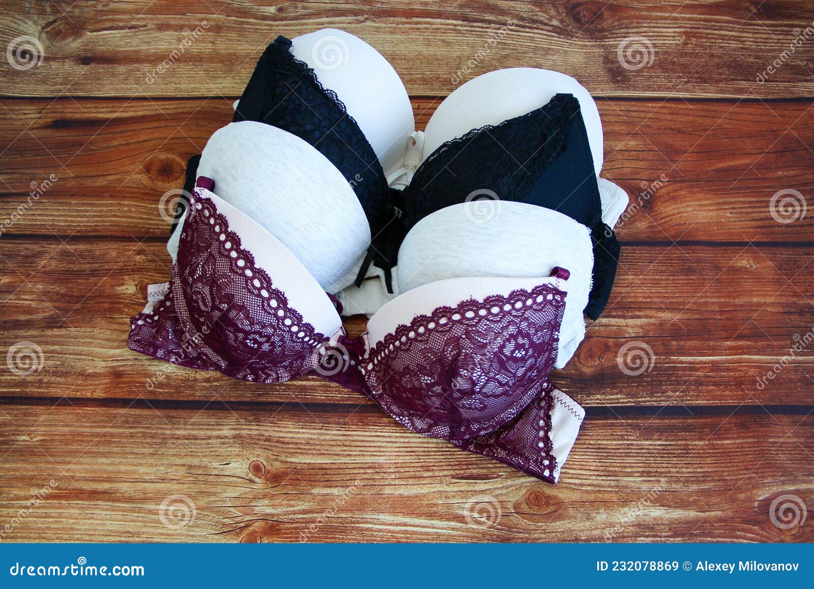 Set of Bras on Wooden Background Stock Image - Image of lingerie